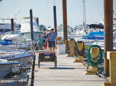 family walking down dock