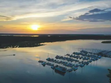 aerial view of skull creek harbor at sunset