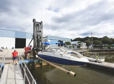 safe harbor skippers landing boat being lifted into water