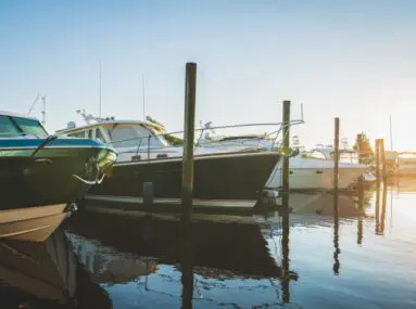 4 boats docked in a marina