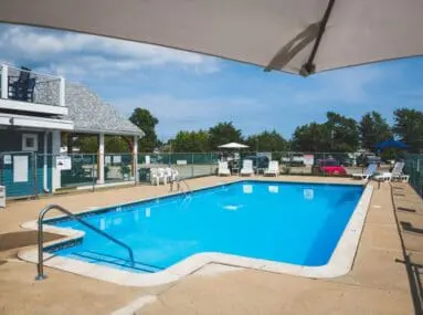 white chairs around a pool