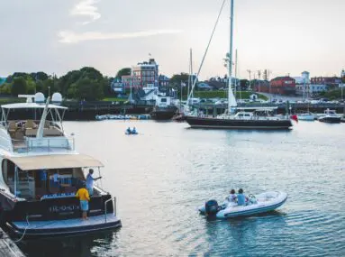 yacht docked in a harbor with other boats around it