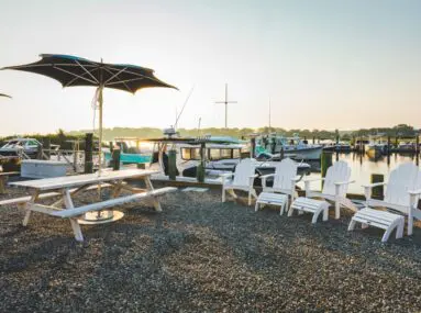 4 white chairs and a white picnic table