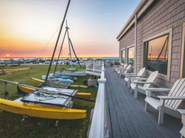 chairs on a porch during sunset