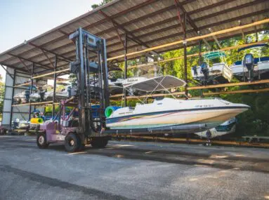 boat on a lift being moved to storage