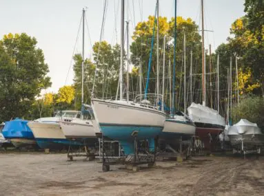 boats sitting on racks outside