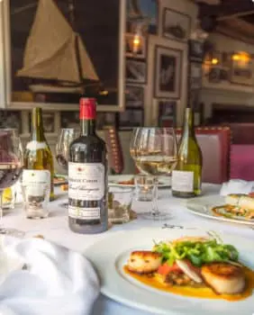 dining table with wine and food