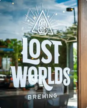 lost worlds sign on window