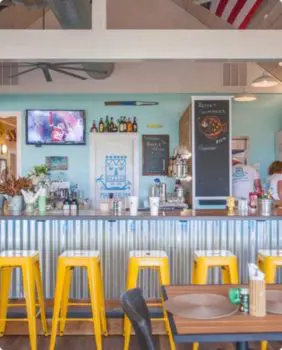 bar with yellow barstools