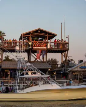Red's upper deck and boat in front of restaurant