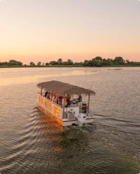 tour boat at sunset