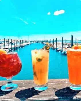 drinks with a view of the ocean as the background