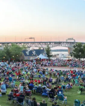 people sitting on riverwalk