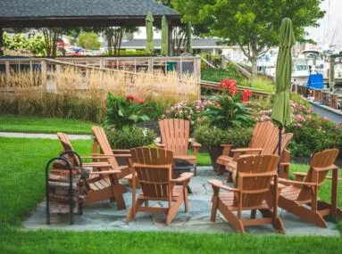 brown chairs around a fire pit