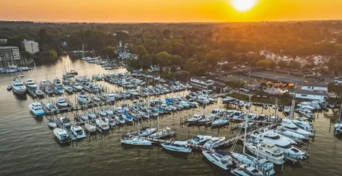 aerial view of a marina at sunset with many boats