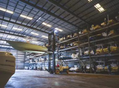 boat being moved in a hanger to be stored