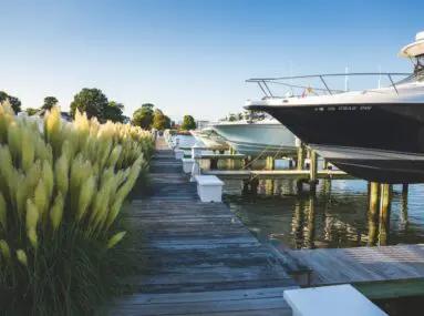 close up of boats docked out of the water in slips