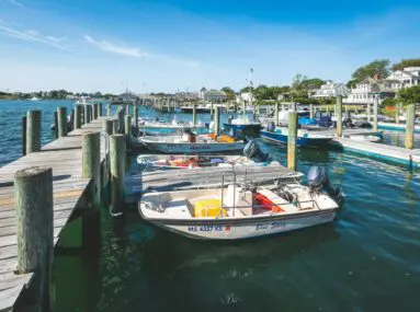 Small fishing boats docked at marina