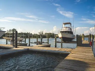 Dock with boats hoisted out of the water