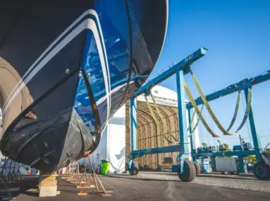 underside of boat next to a marine travelift