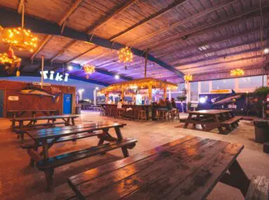 tiki bar with picnic tables