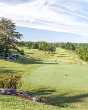 men golfing on a golf course