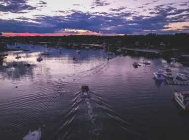 boats on water at sunset