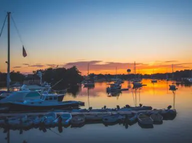 boats in a marina at sunset