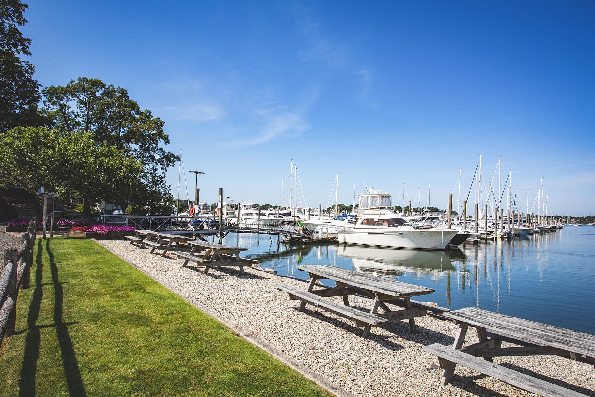 Picnic tables lining water
