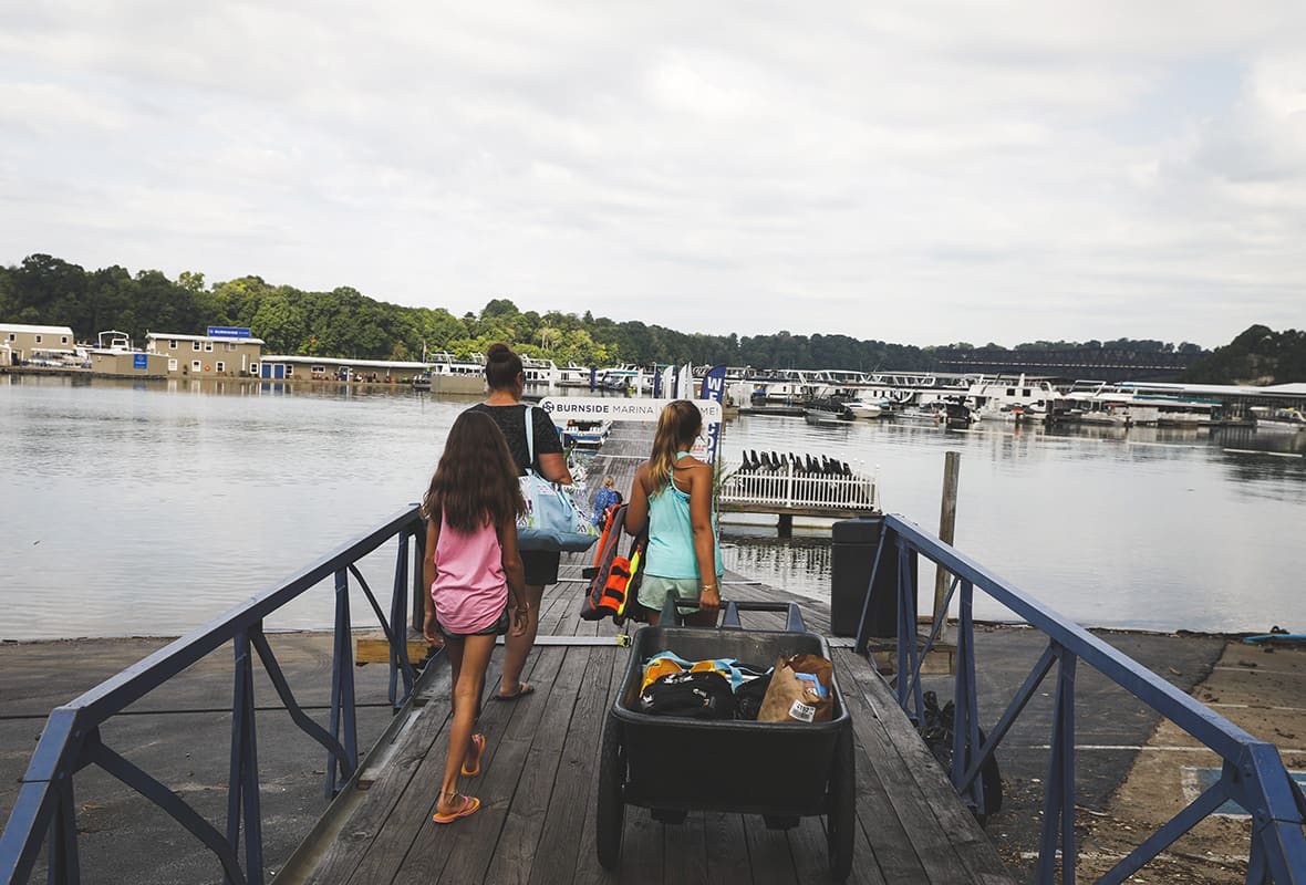 Mom and daughters going to load their boat