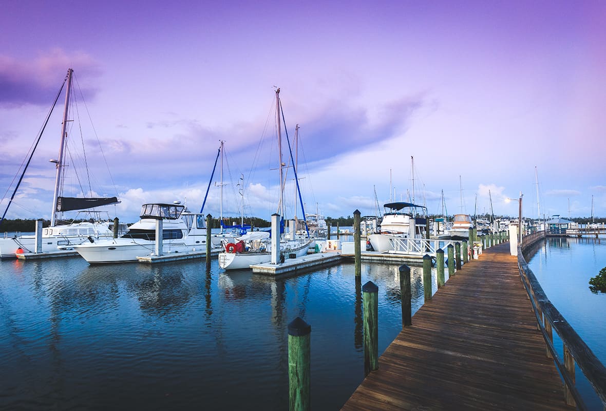 Boats docked at sunset