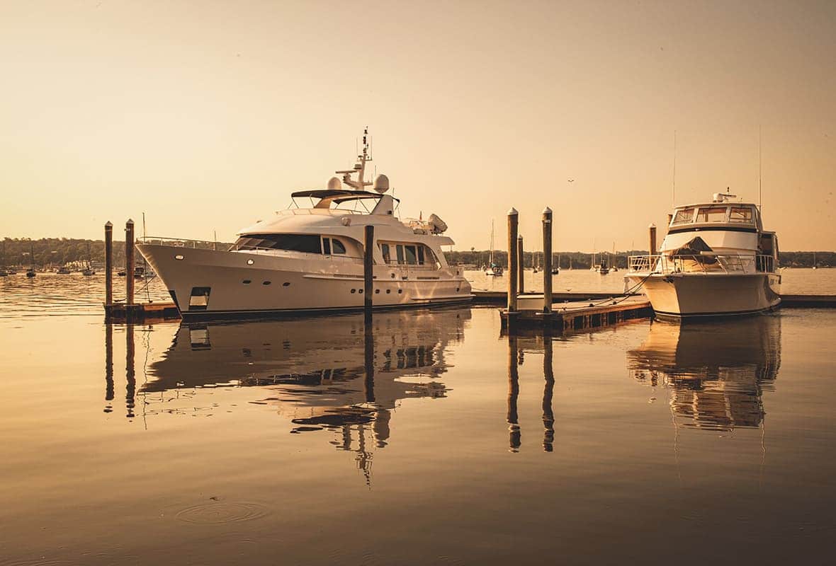 Boats docked at sunset