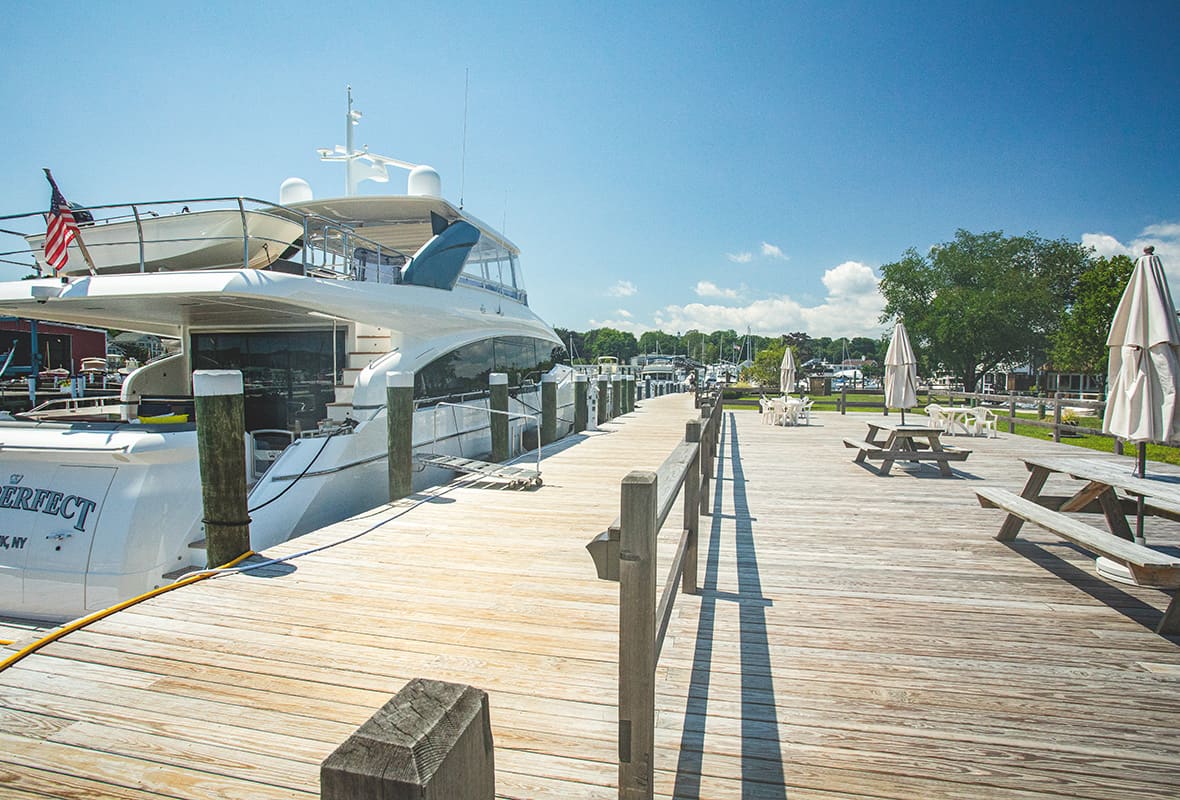 Picnic table and boats at dock