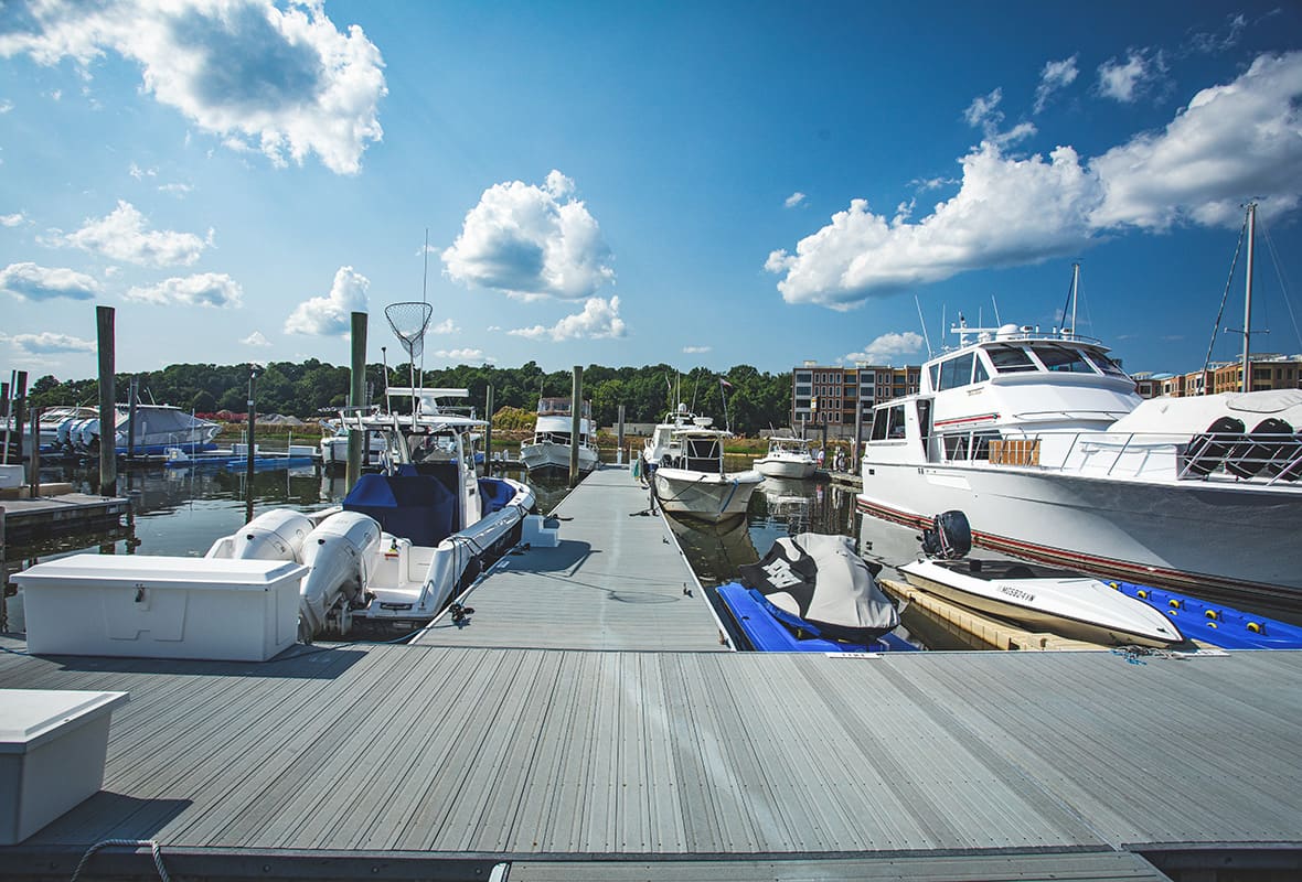 Jet skis and boats docked at marina