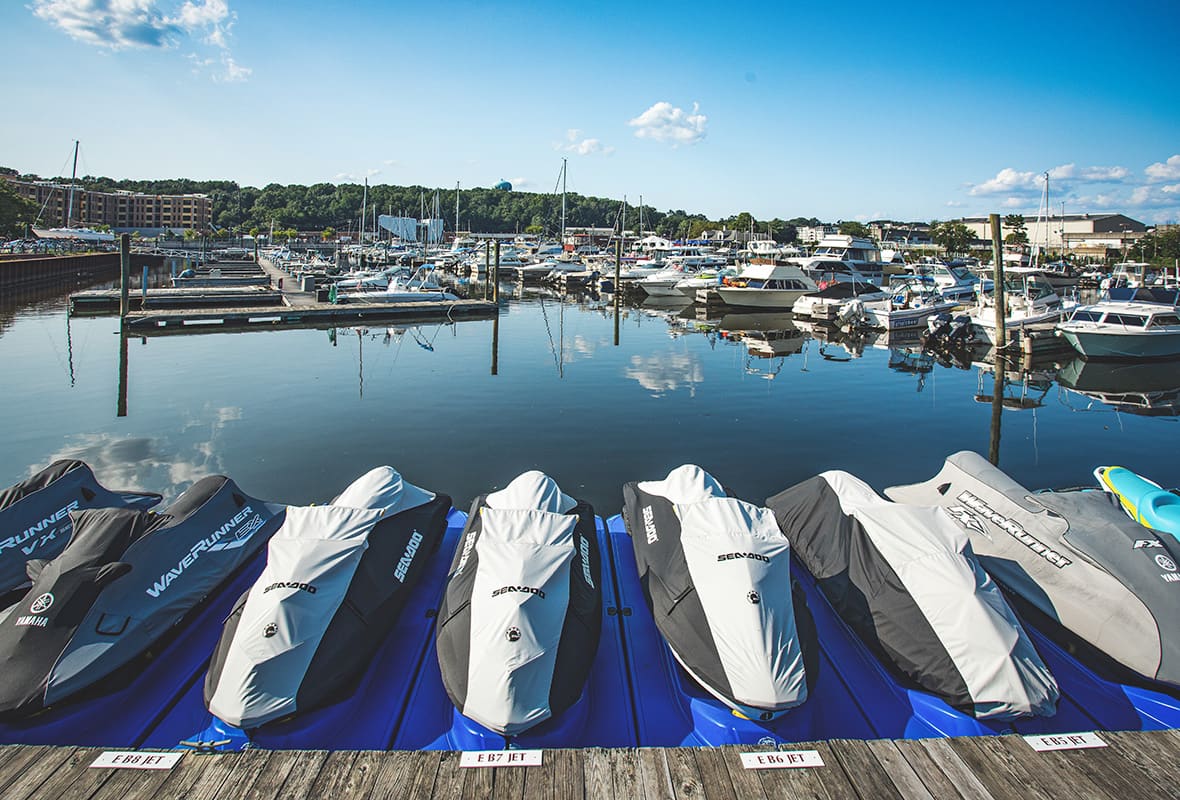 Jet skis docked at marina