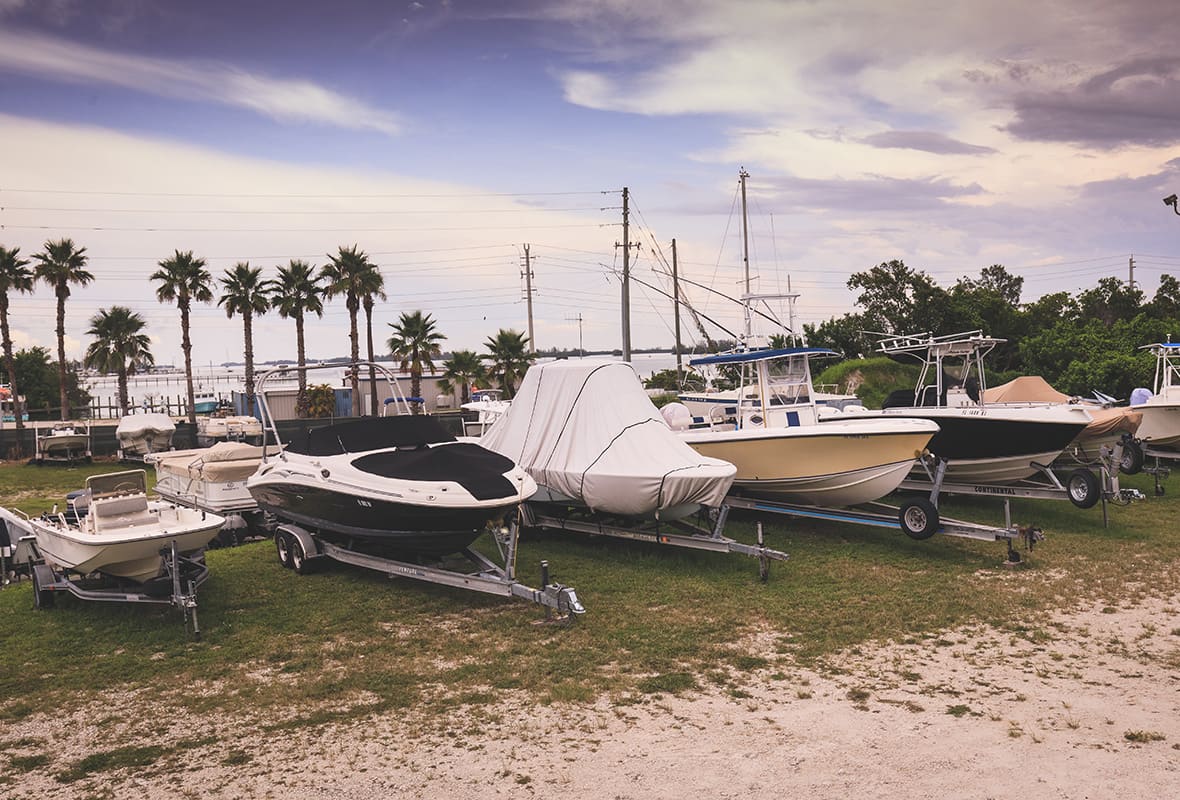 Boats in storage area on land