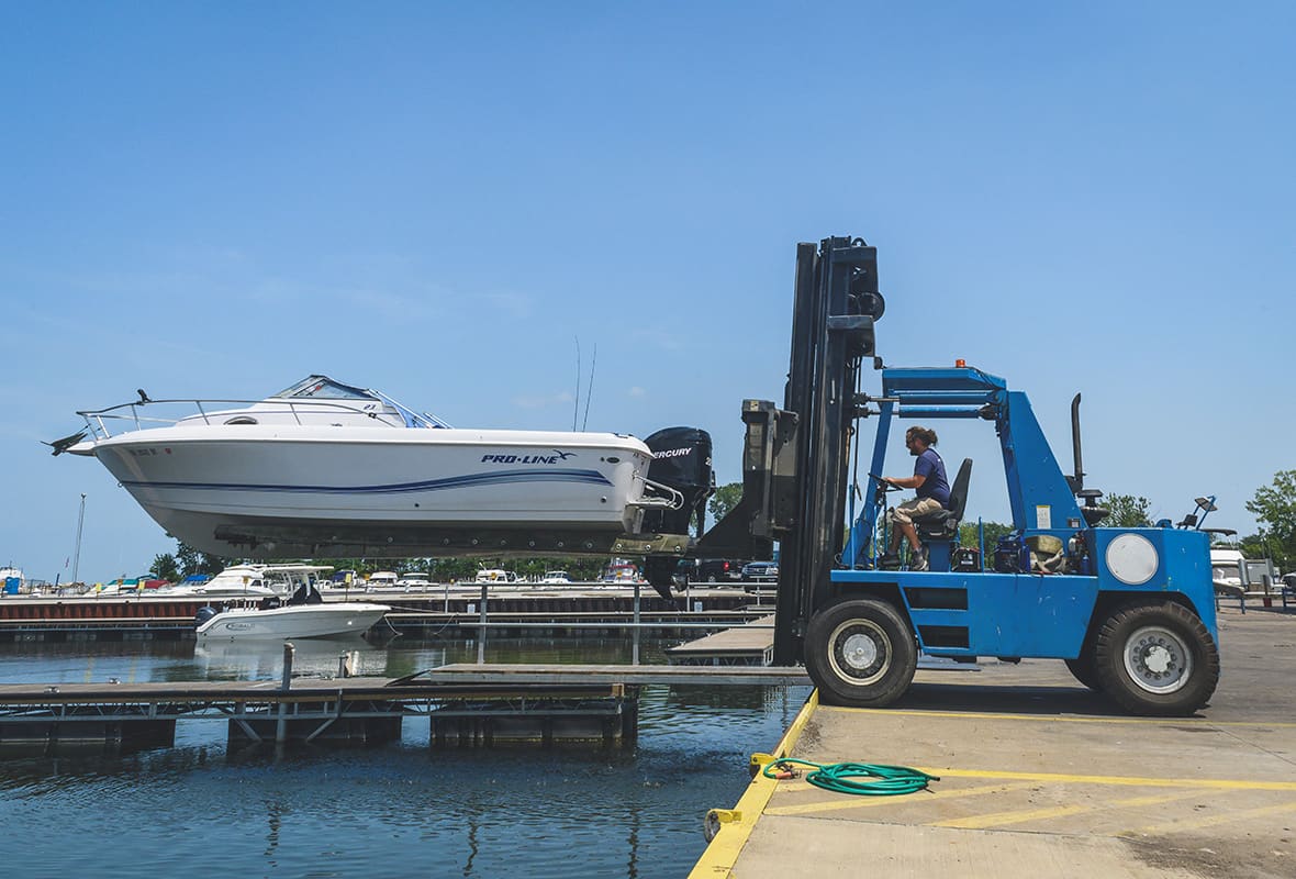 Boat being brought down from storage to water