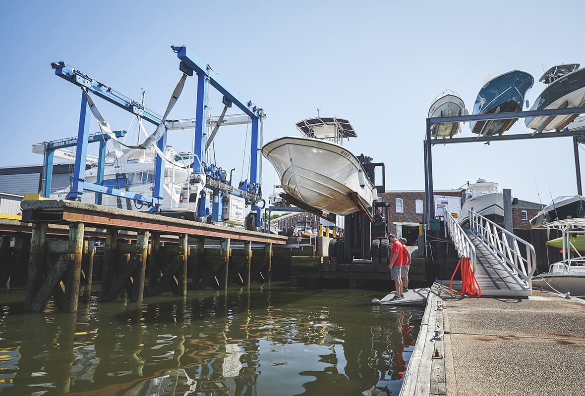 Boat being lifted down to water