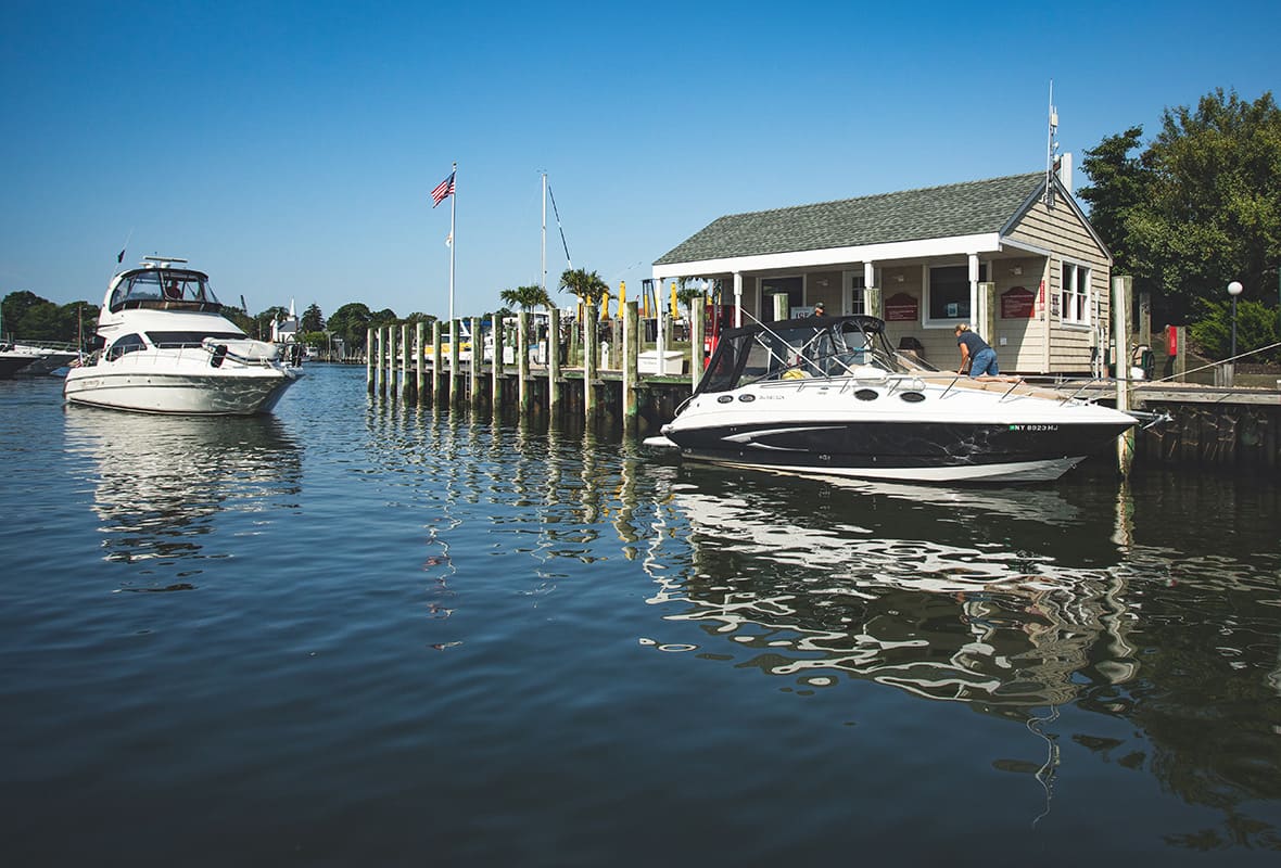 Boats docking at marina