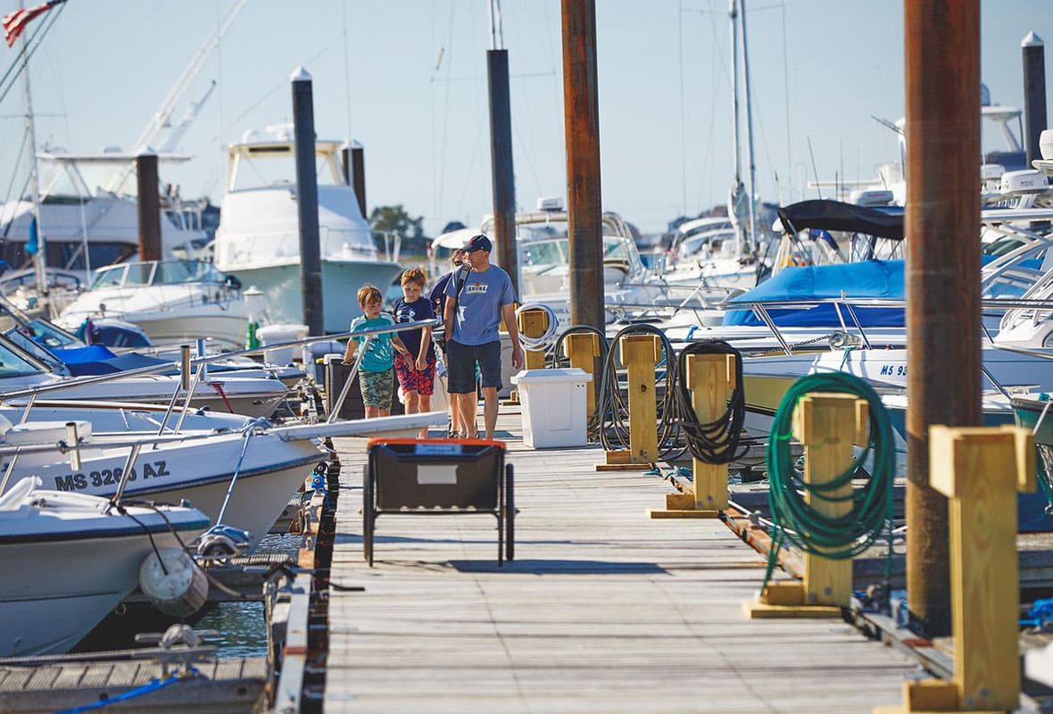 family walking down dock