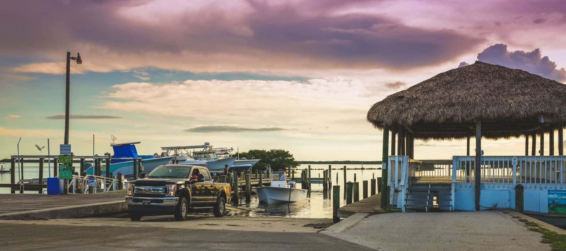 truck pulling boat out of water