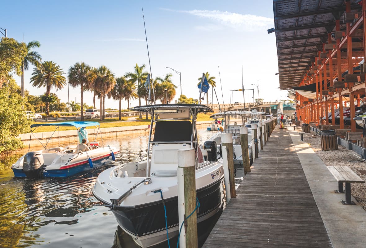 many boats tied up to a dock