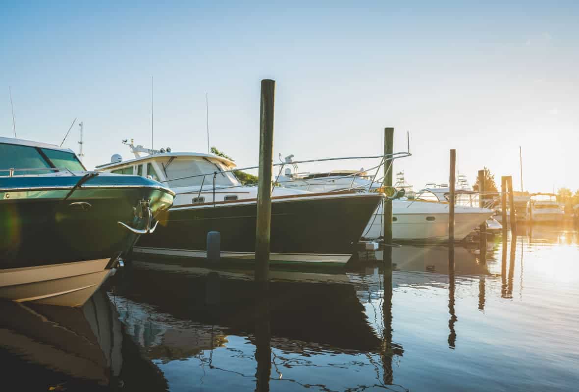4 boats docked in a marina