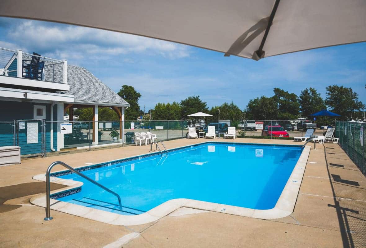 white chairs around a pool