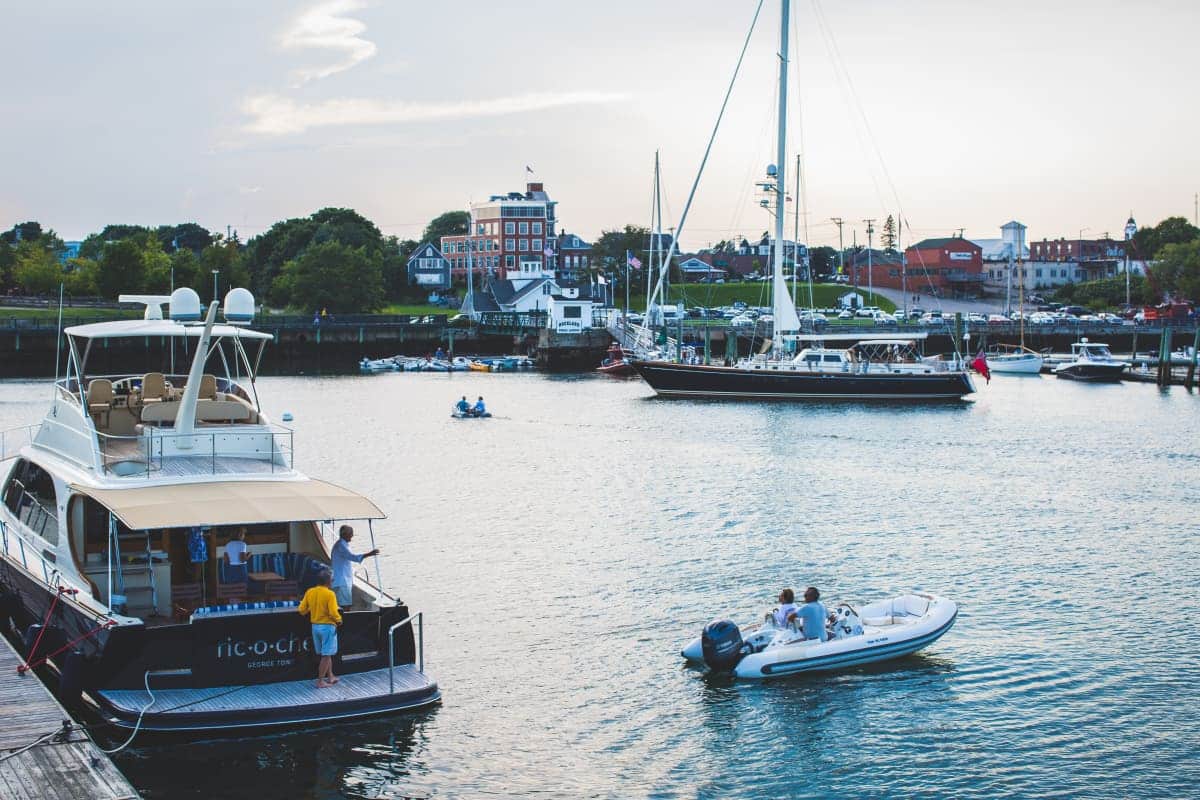 yacht docked in a harbor with other boats around it