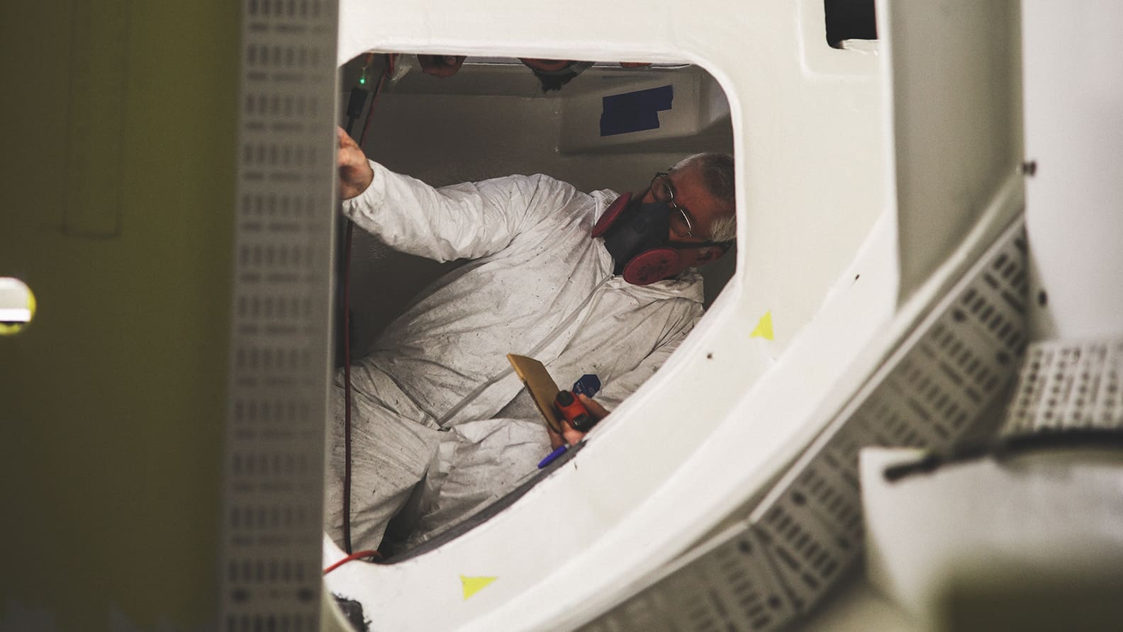 team repairing fiberglass