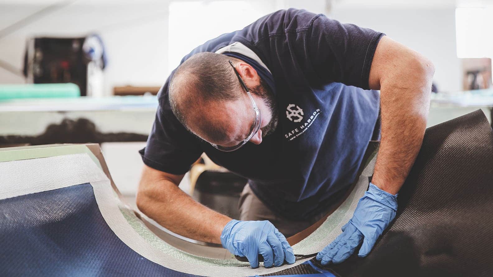 man working on fiberglass