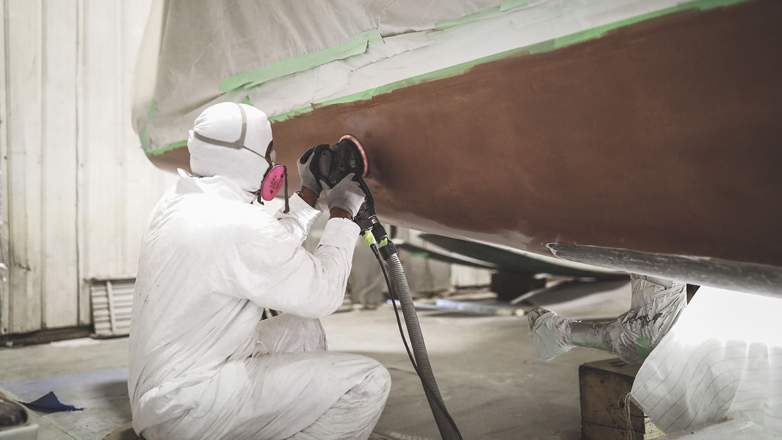 team repairing fiberglass