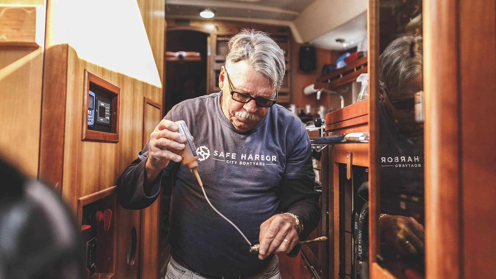 man repairing plumbing