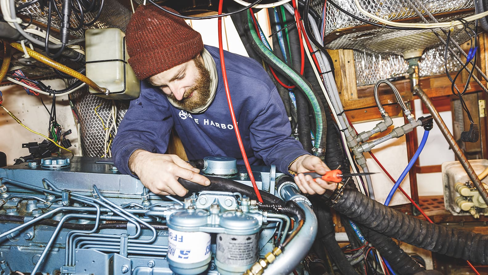 man fixing boat